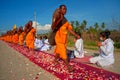 Row of Buddhist hike monks on street. Royalty Free Stock Photo