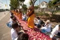 Row of Buddhist hike monks on street. Royalty Free Stock Photo