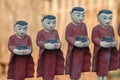 Row of buddhist monks with alms bowls Royalty Free Stock Photo