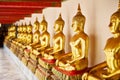 A row of Budhha statues in Wat Pho Temple, Temple of the Reclining Buddha, Bangkok, with a full name  of Wat Phra Chetuphon Wimon Royalty Free Stock Photo