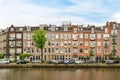 a row of buildings overlooking a body of water