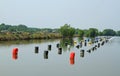 Row of buoys in aquatic farm Royalty Free Stock Photo
