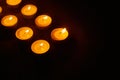 Row of burning circle candles Royalty Free Stock Photo