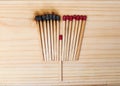 Row of burning matches and all matches on white background Royalty Free Stock Photo