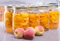 Row of canned peaches