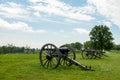 Row of Cannon Artillery Pointing over Landscape Royalty Free Stock Photo