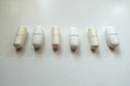 Row of capsules of magnesium and caplets of calcium citrate