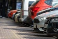 A row of cars in the parking lot near the office building Royalty Free Stock Photo