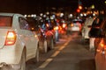 row of cars stopped in front of traffic light at night Royalty Free Stock Photo