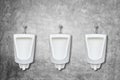 Row of ceramic outdoor urinals in men public toilet install on t Royalty Free Stock Photo