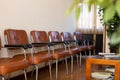 Row of chairs in empty medical clinic waiting room