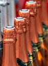 Row of champagne bottle necks Royalty Free Stock Photo