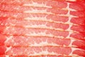 Row of chunks of smoked red appetizing meat Royalty Free Stock Photo
