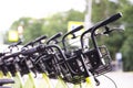 Row of city parked bicycles bikes for rent on sidewalk. Bike Bicycle Parking In European City