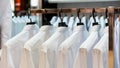 Row of cloth hangers with shirts Royalty Free Stock Photo