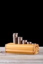 A row of coins are on the bamboo slips of ancient books Royalty Free Stock Photo