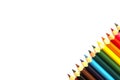 Row of color pencils with copy space on white background. Royalty Free Stock Photo