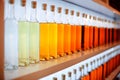 A row of colored bottles with cognac Royalty Free Stock Photo