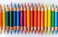 Row of Colored Pencils Against White Background Royalty Free Stock Photo