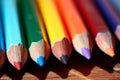 A Row of Colored Pencils on a Wooden Table Royalty Free Stock Photo