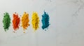 A row of colored powders on a white surface Royalty Free Stock Photo