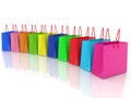 Row of colored shopping bags on white Royalty Free Stock Photo