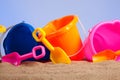 Row of colorful beach buckets or pails Royalty Free Stock Photo