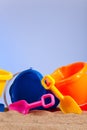 Row of colorful beach buckets or pails Royalty Free Stock Photo