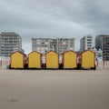 Five colorful beach huts against grey sky and background Royalty Free Stock Photo