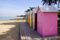 Row of colorful beach huts in the sand beach in atlantic west french coast Royalty Free Stock Photo