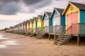 Row of colorful beach huts at the sandy beach Royalty Free Stock Photo