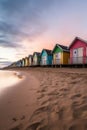 a row of colorful beach huts on a sandy shore Royalty Free Stock Photo