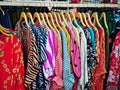 Colorful Blouses for Ladies Hanging on Rack for Sale at Clothing Store