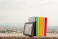 Row of colorful books with e-book reader Royalty Free Stock Photo