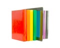 Row of colorful books and electronic book reader Royalty Free Stock Photo