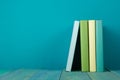Row of colorful books, grungy blue background, free copy space Royalty Free Stock Photo