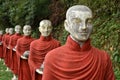 A row of colorful Buddhist monk statues, Hpa-An, Myanmar Royalty Free Stock Photo