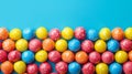 A row of colorful candy balls on a blue background, AI Royalty Free Stock Photo