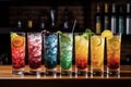 Row of colorful cocktails with different flavors in glass glasses Royalty Free Stock Photo