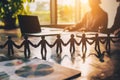 Paper People Chain Standing on Table Royalty Free Stock Photo