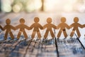 Paper People Chain Standing on Table Royalty Free Stock Photo