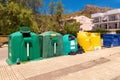 A row of colorful dustbins for waste