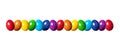 Row of slightly twisted, colorful dyed eggs, multi colored eggs