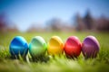 Row of Colorful easter eggs in fresh green grass Royalty Free Stock Photo