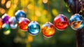 row of colorful glass balls hanging from string Royalty Free Stock Photo