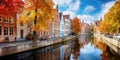 row of colorful houses in the bruges canals. stepped-gable houses, triangular gables