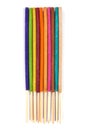 Row of colorful incense sticks isolated on white texture background Royalty Free Stock Photo