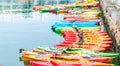 Row of colorful kayaks for rent in the water Royalty Free Stock Photo