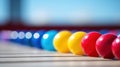 A row of colorful marbles on a wooden surface, AI