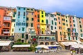 Row of colorful multicolored buildings houses and restaurants of Portovenere coastal town village in harbor of Ligurian sea, Rivie